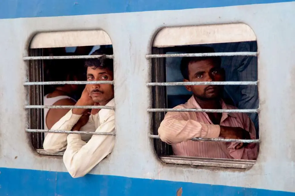 Why Train Stations Can Be Great For Capturing Everyday Life 2 Two Men On Train At Delhi Train Station In India By Ralph Velasco