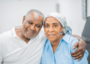 Ethnic And Racial Discrimination In Healthcare &Raquo; Photo Of An Older Black Woman With Cancer Sitting Close To Her Husband Canva E1673060864199 300X214 1