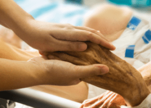 Pros And Cons Of Hospice Care &Raquo; Photo Of A Woman Holding The Hand Of A Sick Elderly Patient Pixabay Resized On Canva E1672686480652 300X215 1