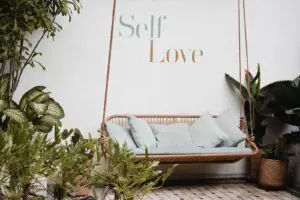 Self Love Image Showing Swinging Chair And Pictures, Very Relaxing Atmosphere