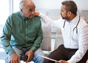 How To Choose A Cancer Treatment &Raquo; Photo Of A Doctor Comforting A Patient By Putting His Hand On His Shoulder Canva 1 300X214 1