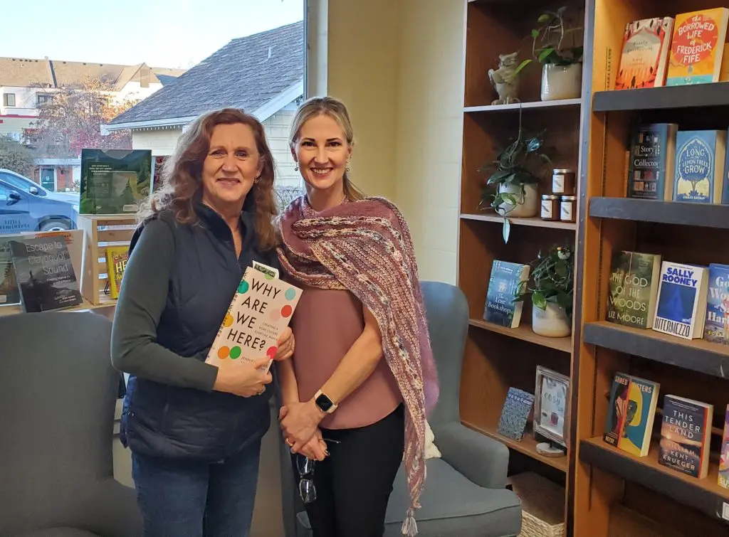Photo With Christina, Owner Of The Mulberry Bush Bookstore, Picking Up The Copy Of Why Are We Here.