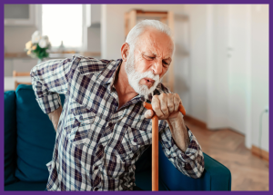 Managing Ms Symptoms &Raquo; Photo Of A Senior Man Sitting On A Sofa With A Pained Expression On His Face While Holds A Cane With One Hand And Touches His Back With His Other Hand Canva Border Added 1 300X215 1