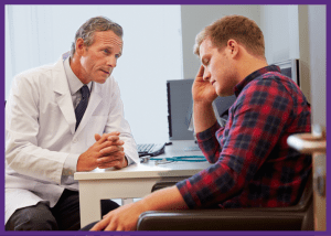 What You Need To Know About Male Breast Cancer &Raquo; Photo Of A Sad Young Man Sitting With His Hand On His Head While Talking To His Doctor Canva Border 1 300X214 1