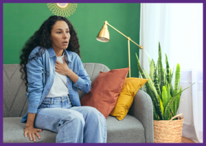 Managing A Respiratory Disorder: Tips For Patients And Families &Raquo; Photo Of A Woman Sitting On Her Sofa Holding Her Chest Struggling To Breathe Canva Border Added 1 300X214 1