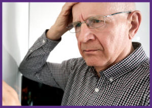 Clinical Trials For Alzheimer’s Disease &Raquo; Close Up Photo Of A Senior Man With A Confused Look On His Face Holding A Hand On His Head Canva Border 1 300X214 1