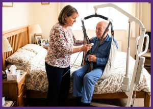 How Do Patient Lifts Help Family Caregivers And Patients? &Raquo; Gemini Created Phot Of A Woman Using A Patient Lift To Get Her Husband Out Of Bed Border Added On Canva 1 300X214 1