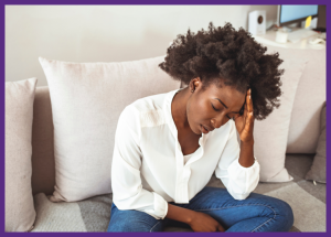 Managing Autoimmune Disease Symptoms &Raquo; Photo Of A Tired Sick Young Woman Sitting On Her Sofa With Her Hand On Her Forehead Canva Border Added 1 300X215 1