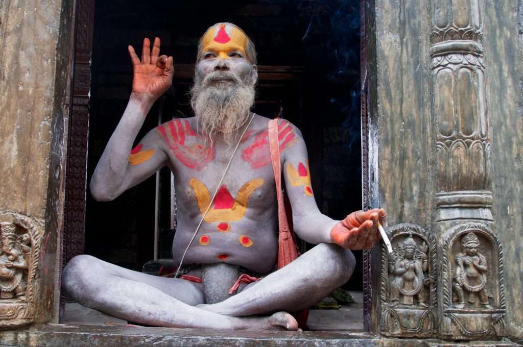 Sadhu In Pashupati Nath With Cigarette In Hand - Kathmandu, Nepal By Ralph Velasco