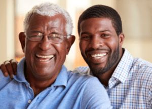 Can Laughing Improve Your Health? &Raquo; Photo Of A Black Father And His Adult Son Laughing Canva 1 E1674005797902 300X215 1