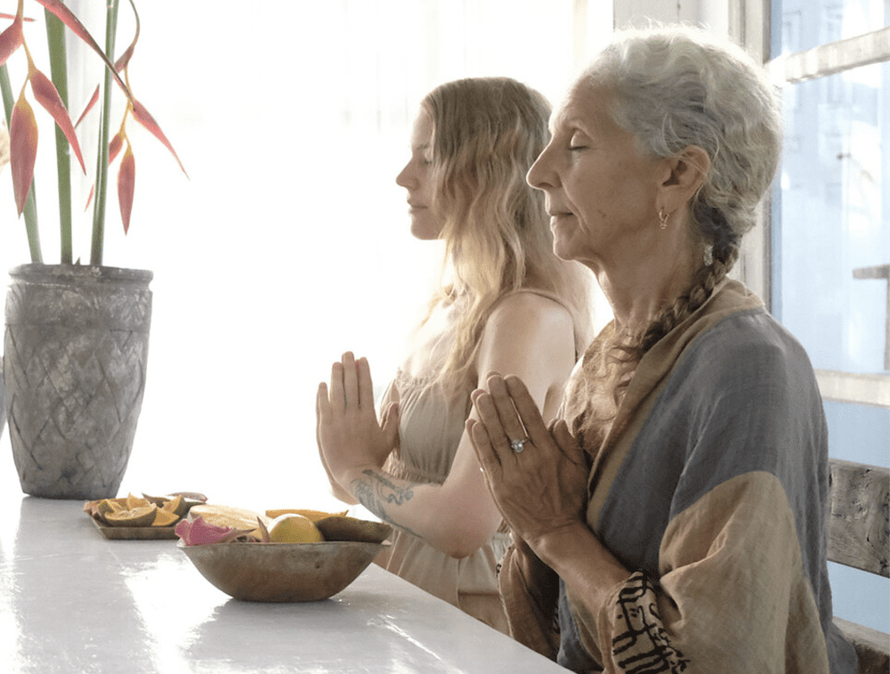 Women In Prayer At Mealtime