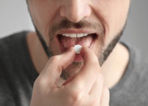 Tips To Take Medication As Prescribed &Raquo; Photo Of A Man With A Beard Putting A White Pill In His Mouth New Canva 1 E1673824990684 300X215 1