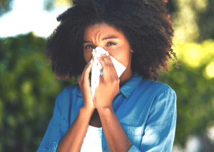 Should You Use An At-Home Allergy Test? &Raquo; Photo Of A Young Woman With Allergies Blowing Her Nose While Standing Outside Canva 1 300X214 1