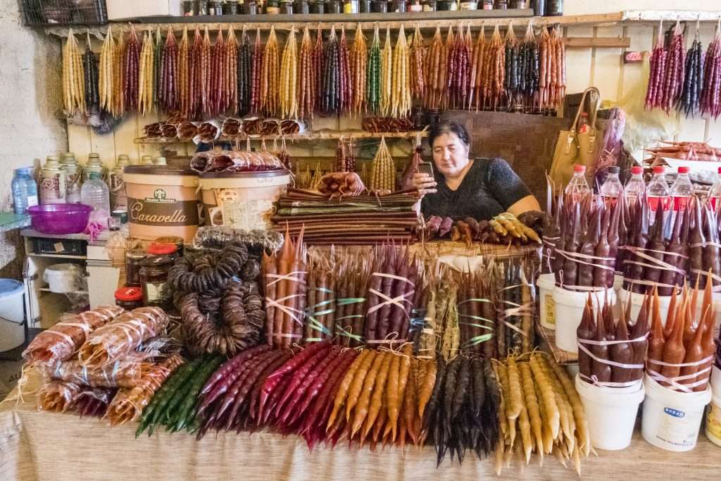 Exploring Wellness Travel: A Holistic Approach For Mature Travelers &Raquo; Woman Vendor Selling Churchkhela Tbilisi Georgia Copyright 2018 Ralph Velasco 1024X683 1