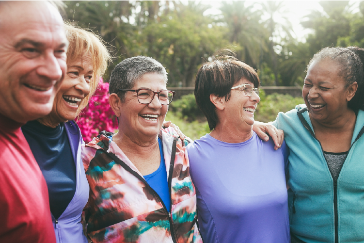 Group Of Seniors Outside Laughing And Smiling Together