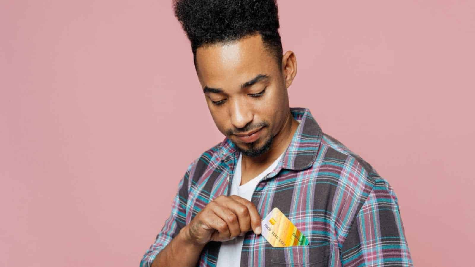 African Young Teen Keeping Credit Card Inside Pocket