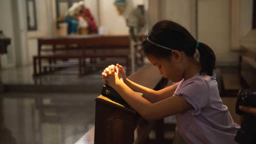 Child Praying In Church