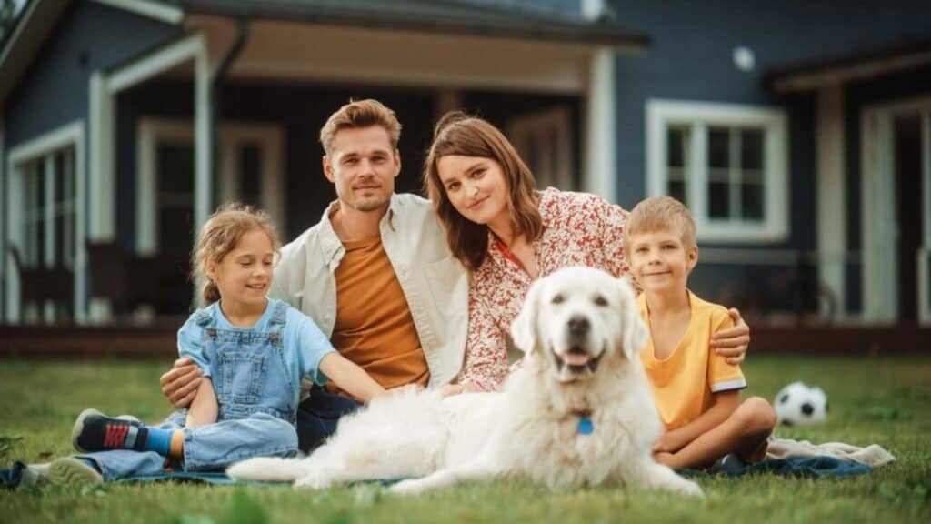 Family In Front Of New House