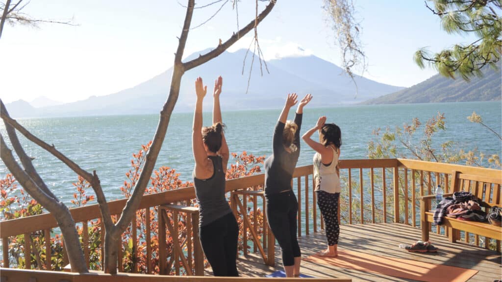 Girls Practicing Yoga On Lake Atitlan