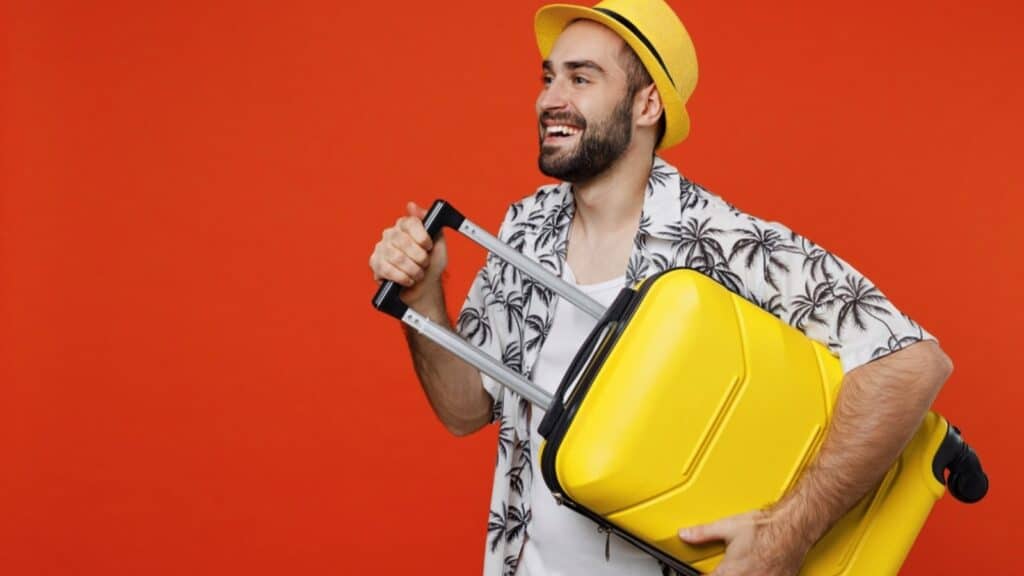 Happy Traveler Man With Suitcase