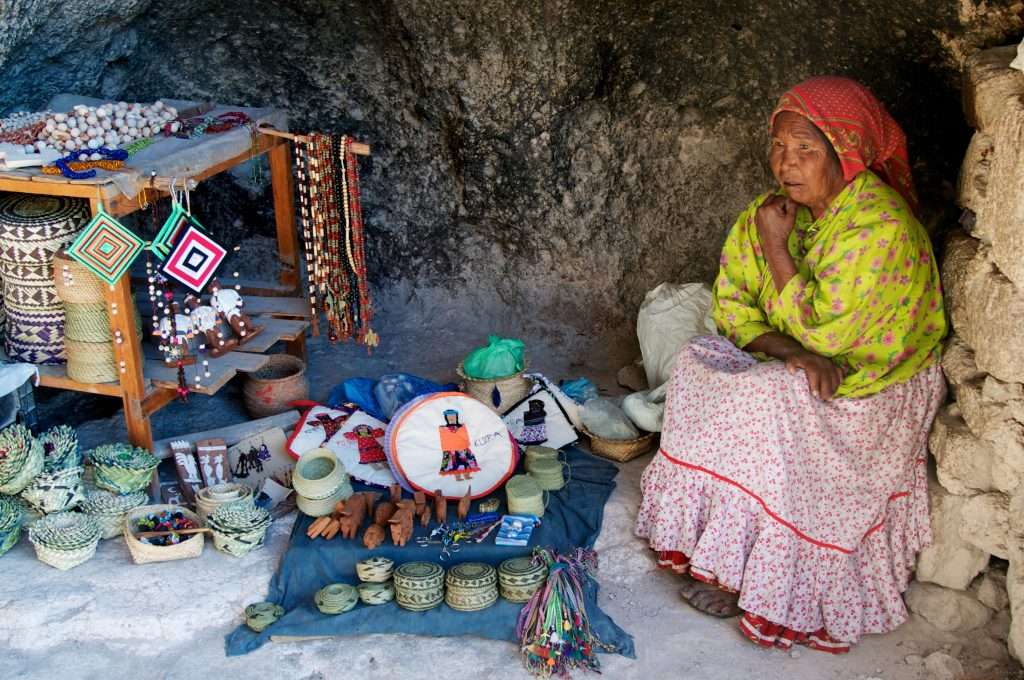 Tarahumara Woman Selling Wares In Cave In Creel, Mexico By Ralph Velasco