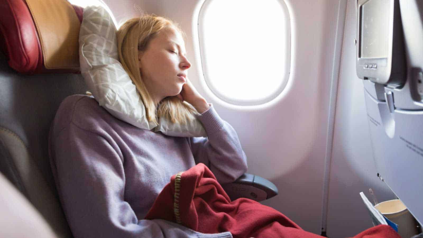 Woman Siting In Window Seat