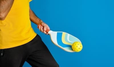 Pickleball &Raquo; Man With Blue Pickleball Paddle In Hand And A Yell 2023 11 27 05 09 04 Utc