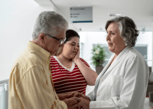 Tips For Coping With A Serious Diagnosis &Raquo; Photo Of A Man And Woman Looking Sad And Worried Getting Bad News From A Female Doctor Canva 1 300X214 1