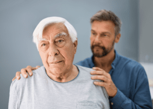 Respite Care Helps Family Caregivers &Raquo; Photo Of A Senior Man Standing With His Son Standing Behind Him With His Hands On His Fathers Shoulders Canva 1 300X214 1