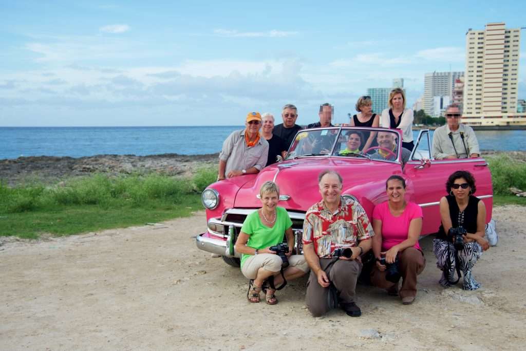 What Are The Benefits Of Small Group Tours? &Raquo; Group With Pink Car Skitched Havana Cuba Copyright 2015 Ralph Velasco 1024X683 1