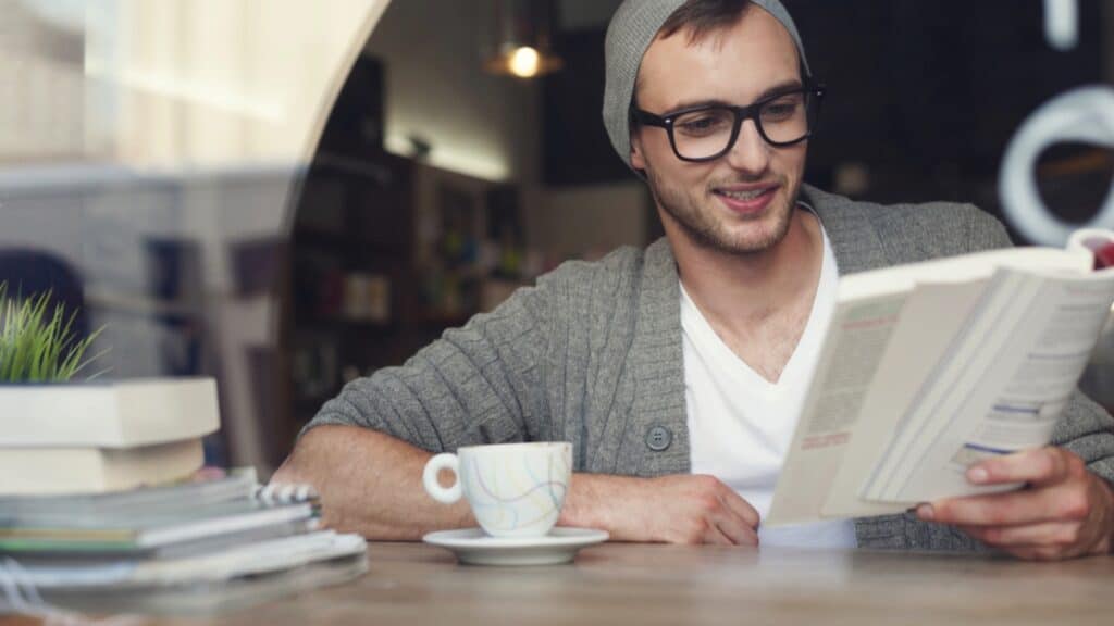 Hipster Man Reading Book