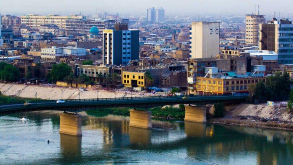 Baghdad, Iraq – January 20, 2014:Aerial Photo Of The City Of Baghdad, And Shows Where Residential Complexes And The Tigris River And Bridge. And Many Of Cars Were Passing. The City Of Baghdad, Capital