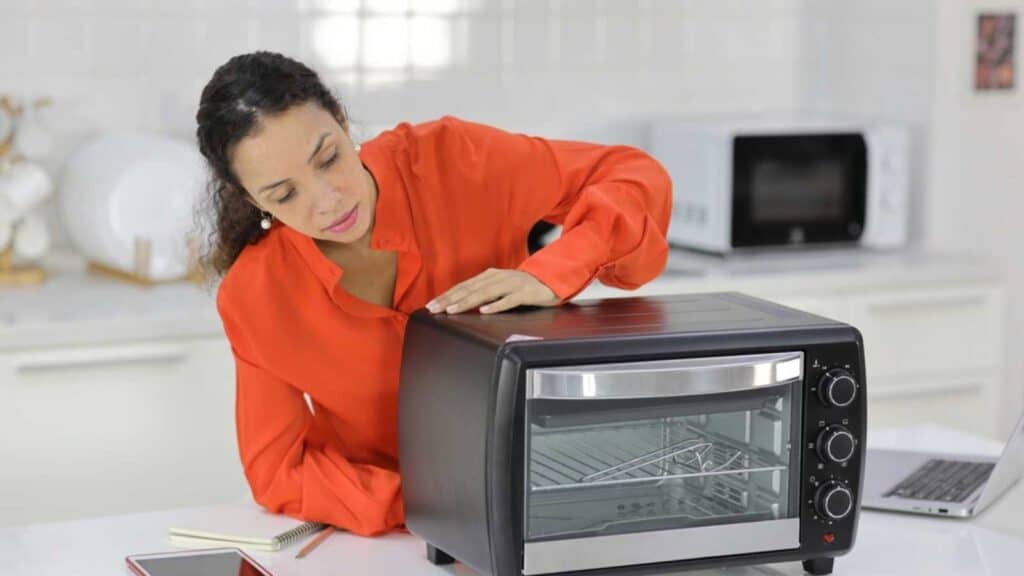 Woman Repairing Microwave