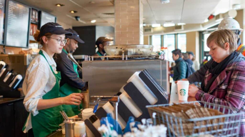 Woman Buying Coffee In Starbucks