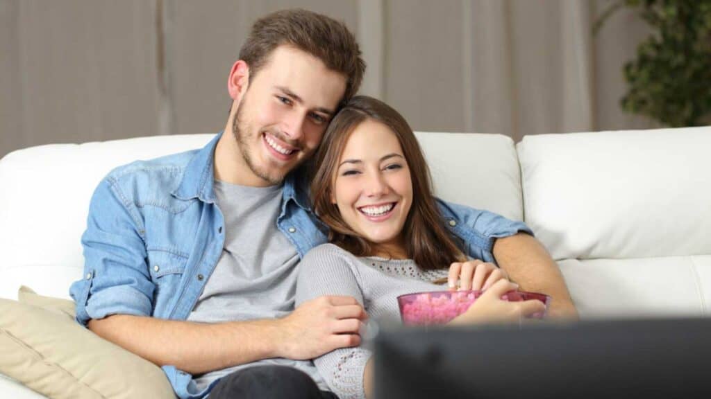 Couples Cuddling While Watching Tv