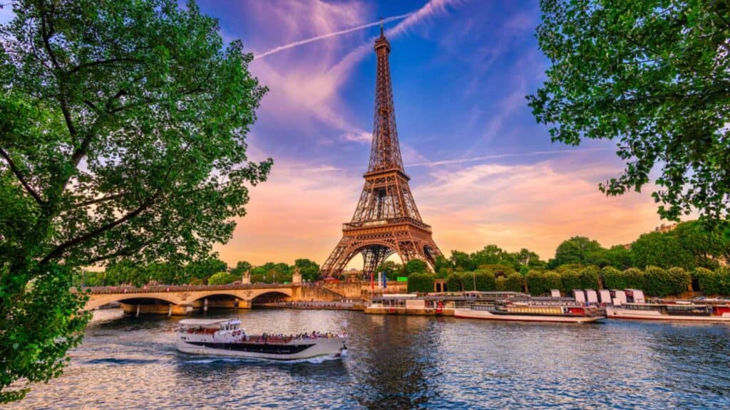 Paris Eiffel Tower And River Seine At Sunset In Paris, France. Eiffel Tower Is One Of The Most Iconic Landmarks Of Paris.