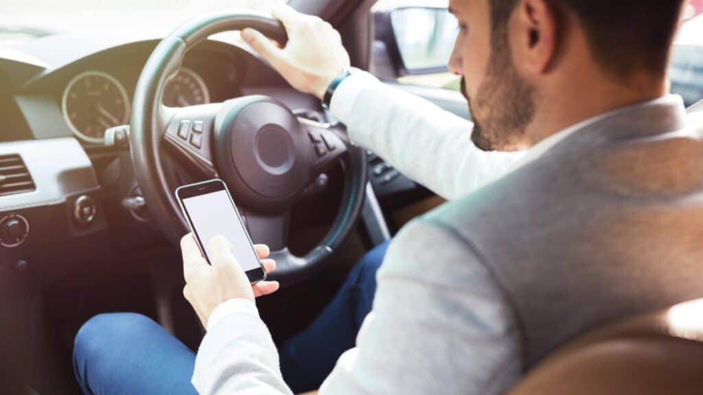 Man Driving Car Using Map