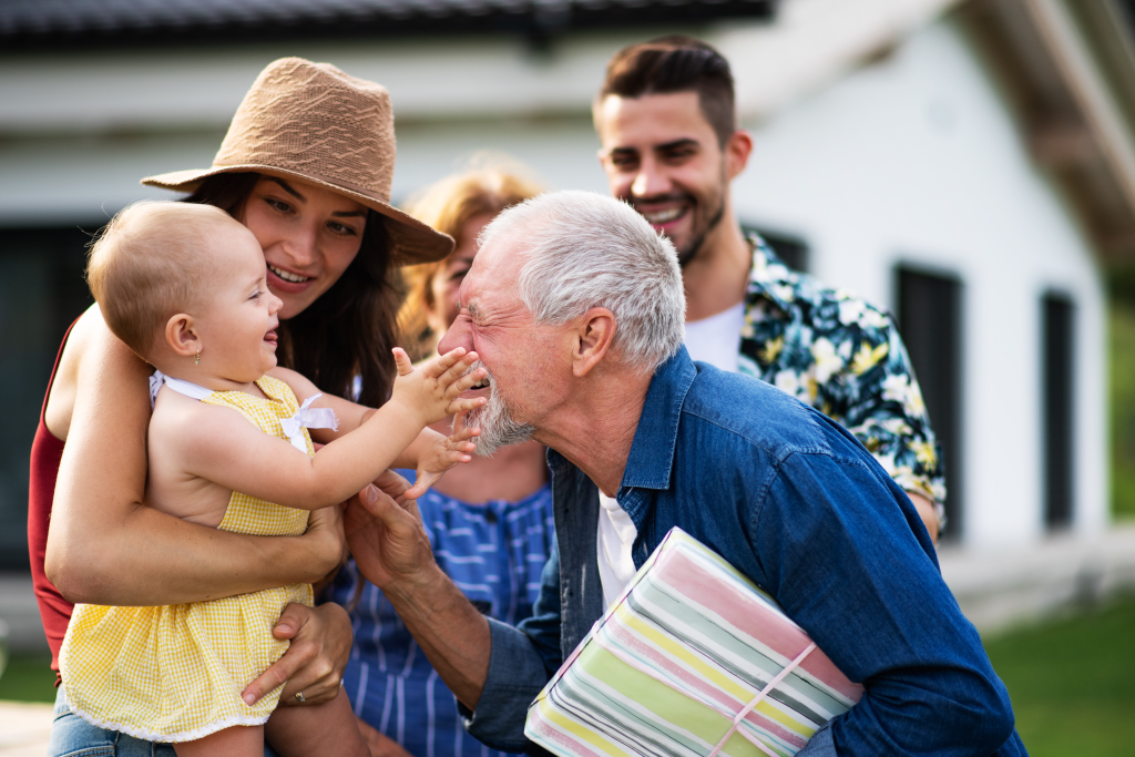 Multigenerational Family Hugging At Event