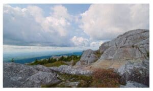 Gray Granite Dome At Mount Monadnock Summit With View Of The Green Hills Surrounding It.