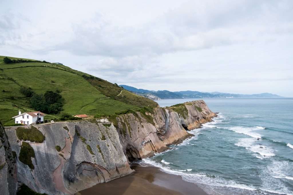 Embracing The Moment: The Power Of ‘Be Here Now’ In Mindful Travel &Raquo; Zumaia Point With White House Zumaia Spain Copyright 2019 Ralph Velasco 1024X683 1