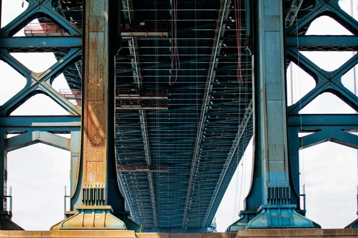 Blue Metal Bridge In Low Angle Photo At Daytime