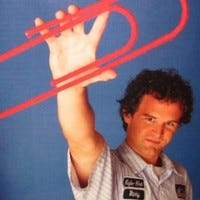 Picture Credit — Kyle Macdonald Linkedin Page. Picture Of Kyle Holding A Red Paper Clip Showing His Resourcefulness