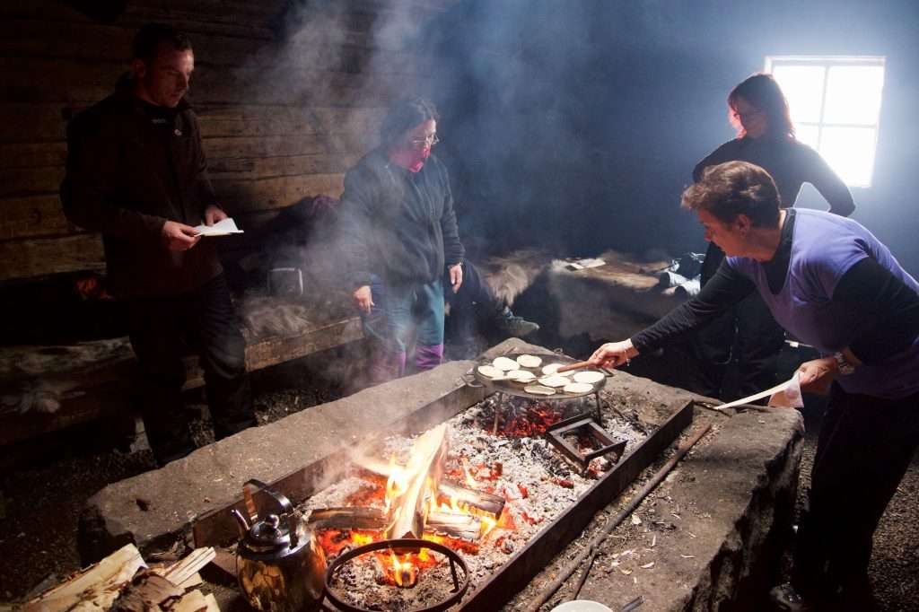 An Intro Guide To Swedish Lapland: Discover The Arctic Wonderland &Raquo; 2 Group Making Bread Indoors Kukkolaforsna Sweden Copyright 2015 Ralph Velasco 1024X682 1