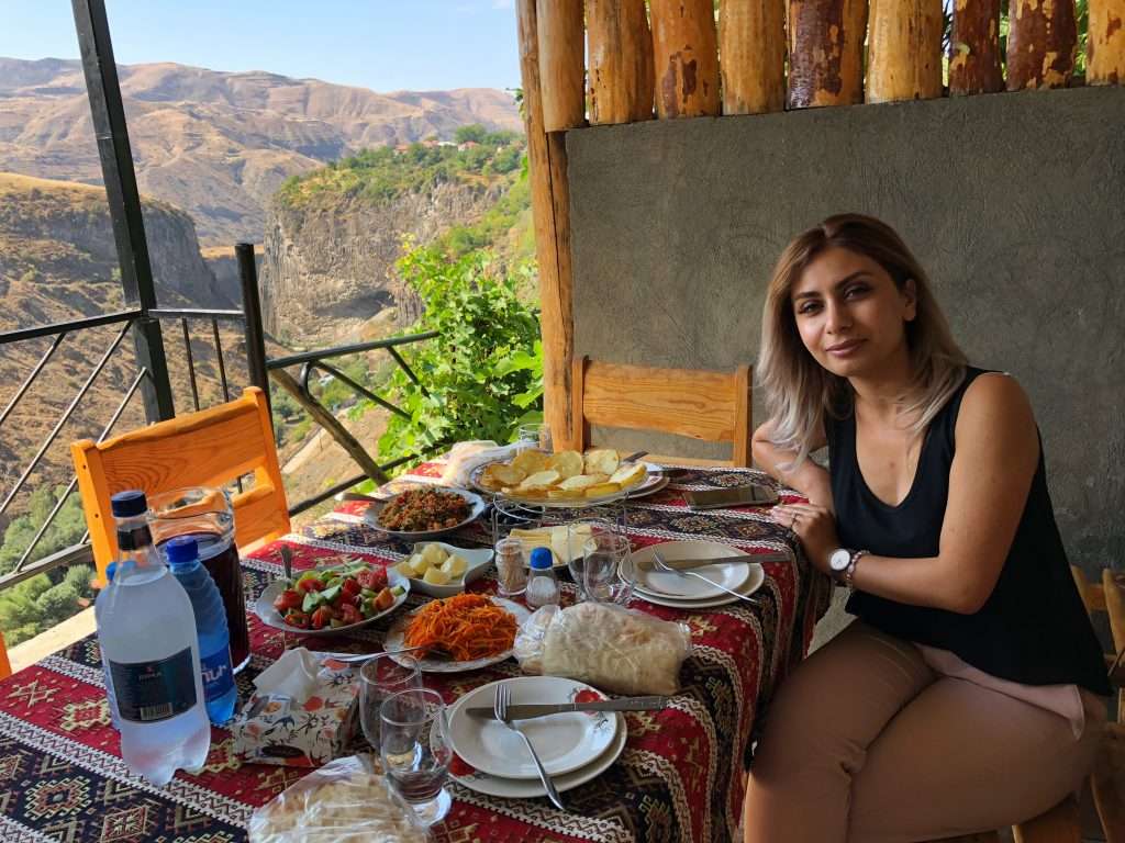 Planning Your Ultimate Armenia Vacation: A Complete Guide &Raquo; Arpi At Table With View Garni Armenia Copyright 2018 Ralph Velasco.jpg 1024X768 1