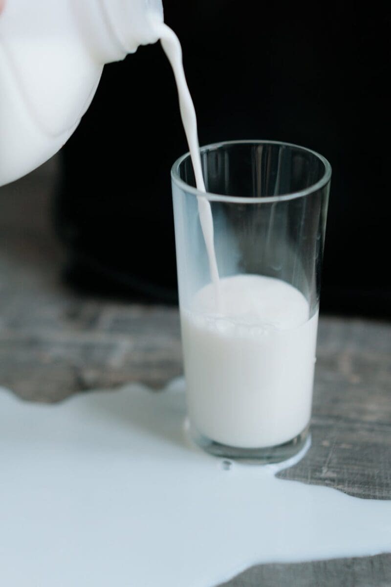 Photo Of Spilled Milk In Clear Drinking Glass