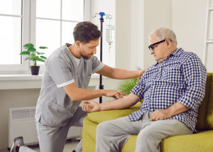 Home Infusion Therapy Risks And Rewards &Raquo; Photo Of A Male Nurse Helping A Senior Man With Is Home Infusion Therapy Canva 1 300X214 1