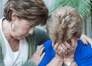 Hospice Care For Dementia Patients – Everything You Need To Know &Raquo; Photo Of A Middle Aged Woman Comforting Her Elderly Mother Who Is Crying With Her Hands Covering Her Face Canva 1 300X214 1