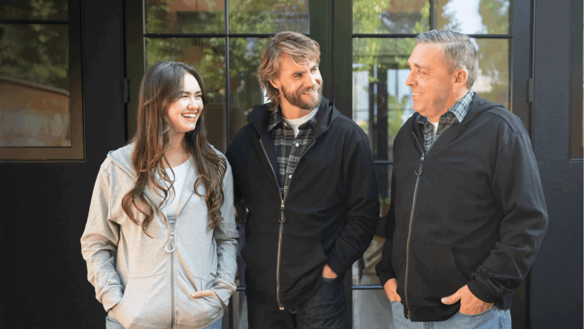 Three People Standing, All Wearing Joe & Bella&Amp;Apos;S Adaptive Sweatshirt